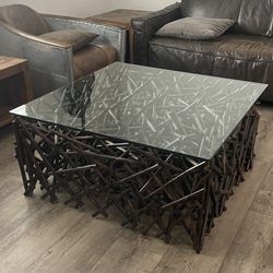 Z GALLERIE Wood Posts Stacked Collage Living Room Coffee Table with Thick Tempered Glass top Coffee Table, (38" x 38"x 18"). In Excellent Condition.