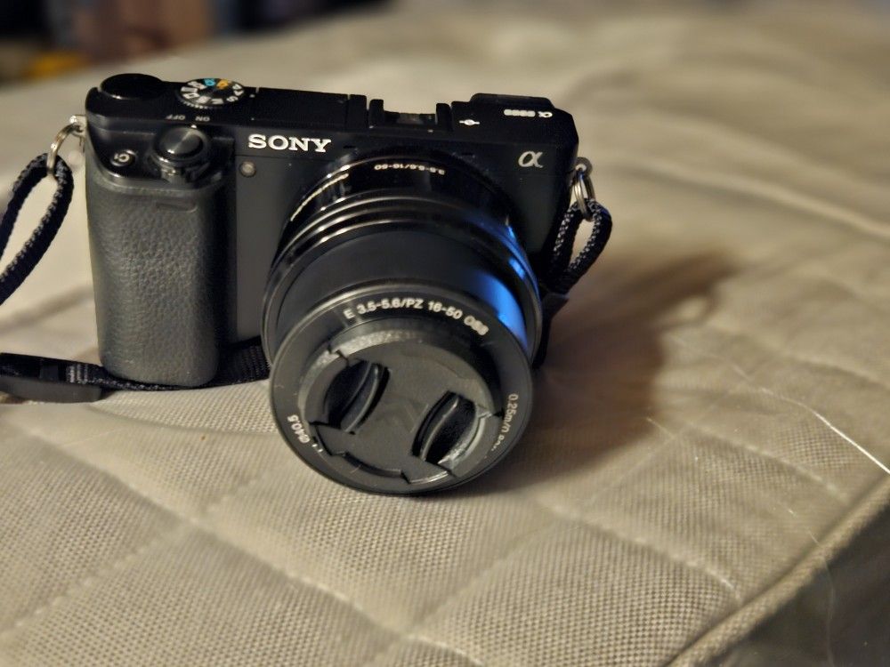 Sony a6000 with 16-50 lens & Nex3 with flash, 3 batteries charger and power adapter