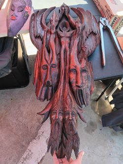 hand-carved wooden relief sculpture