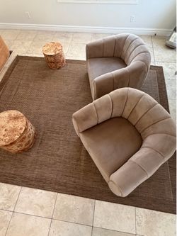 2 lounge chairs with small tables