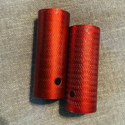 Red bicycle pegs