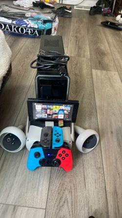 Selling  and TAKING TRADES quest 2 with the controls and a Nintendo with the account and a lot of games and with a full controler