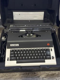 Olympia International X-L12 Electric Typewriter.