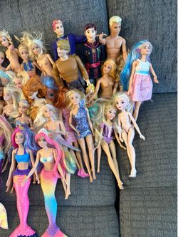 Dolls and Barbies selling them all together