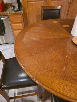 Wood grain finish table with 4 chairs