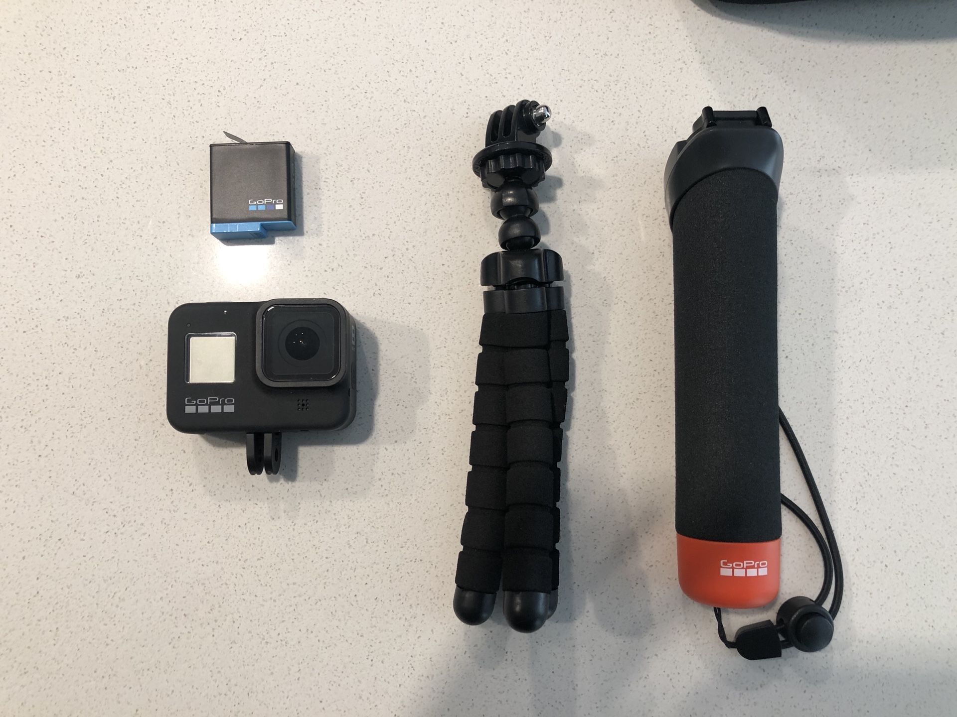 GoPro Hero 8 Black with Extra Battery, 32GB Memory Card, Tripod, Headmount, Car Mount, and Hand attachment.