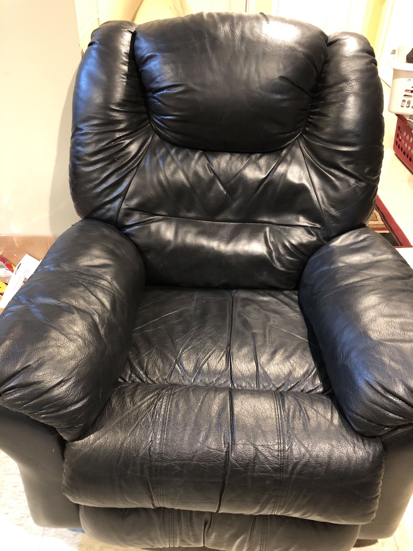 Two solid wood frame futons with 8 inch innerspring mattress 150.00 each. Black leather recliner 75.00, King upholstered headboard 100.00, sub woofer