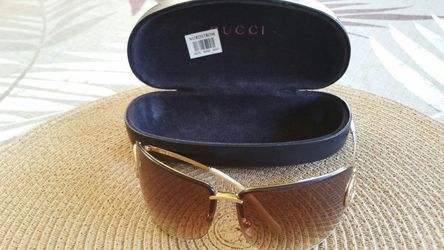 Woman Gucci sun glasses.