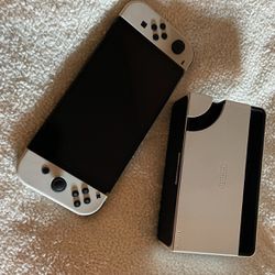 white nintendo switch OLED with doc 