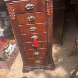 a pretty jewelry cabinet its 43 inches tall 19 inches wide and 13 inchez deep needs a good cleaning 