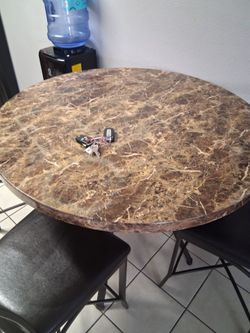 Kitchen table.\nFour chairs