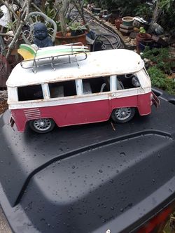 Cool metal tabletop VW bus with surfboards on top
