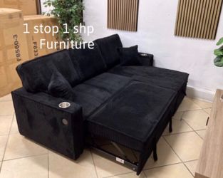 Reversible black sectional sofa with pull-out bed & storage
