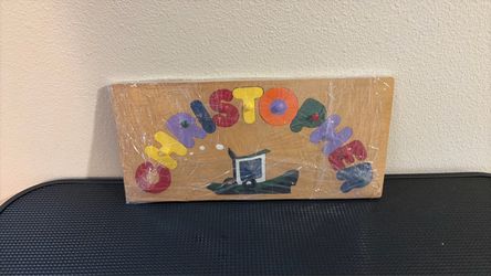 This is a wood puzzle for a child with the name of Christopher.