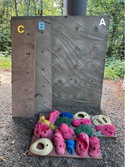 Climbing wall panels and holds
