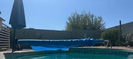 Solar pool cover and reel