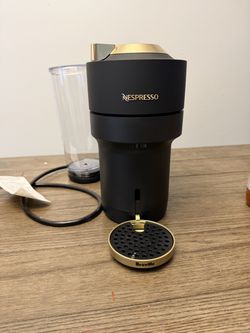 Black and gold nespresso machine