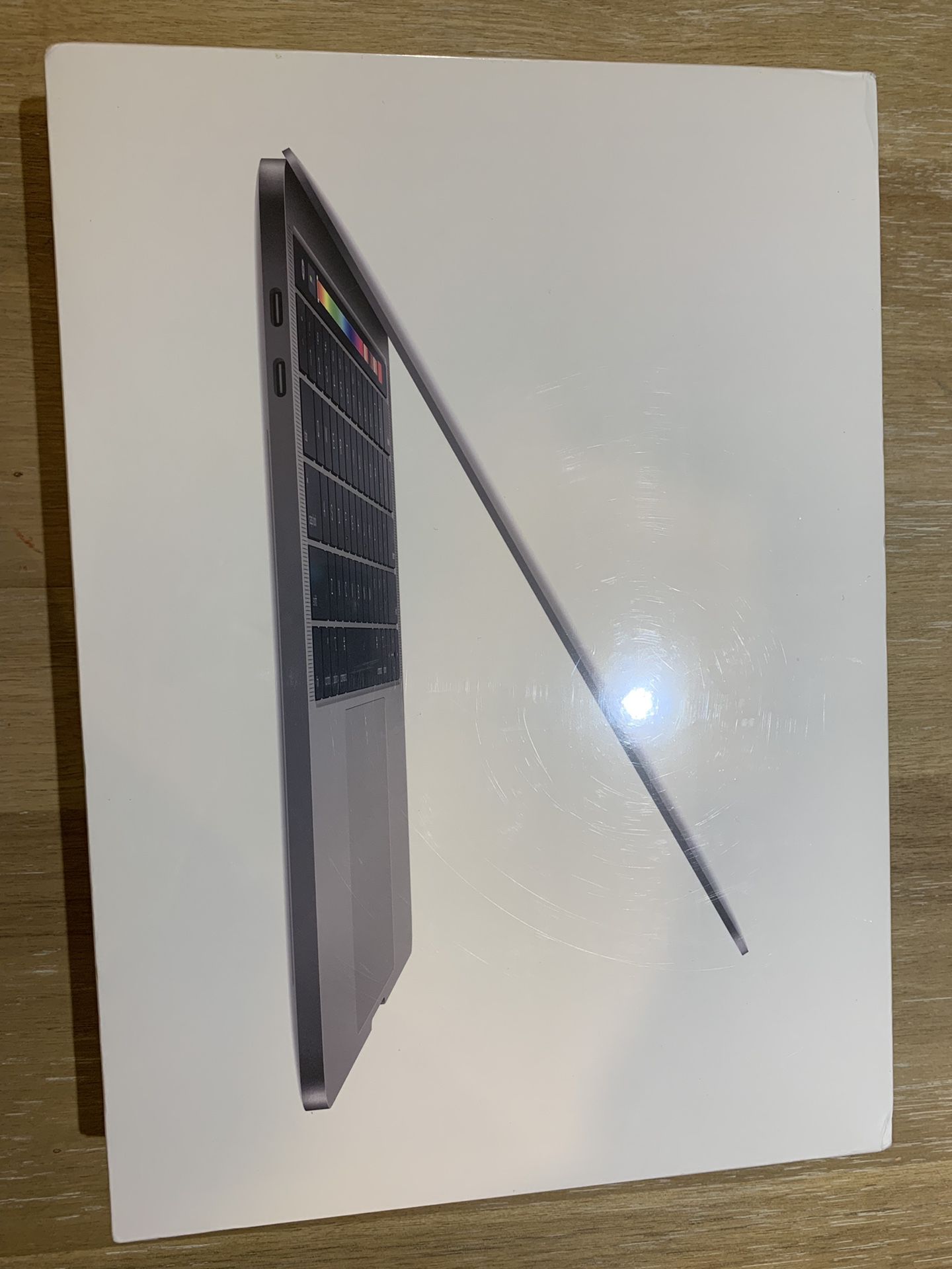 2019 MacBook Pro 13” Retina, quad core i5, 8gb , 256GB brand new sealed, w/Apple care, Touch Bar/ID