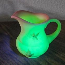 Fenton Autumn Leaf Hand Painted Burmese Custard Glass Vase Pitcher                     Measures 4 5/8“ at the widest point, 3 1/2“ deep, 4 1/2“ tall.