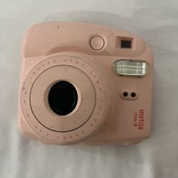 Fujifilm Instax Mini instant camera. Works great, just needs batteries and film.