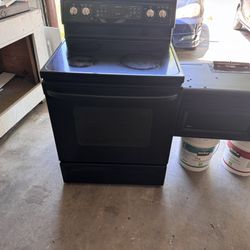 Black Stoves And Black Microwave 