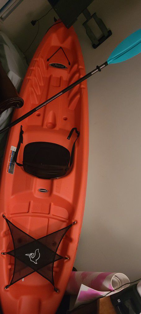 Photo Great condition! Nice gift! Comes with paddle and car foam and straps, ready to go!PELICAN SENTINEL 100X Kayak, ABOUT 39 POUNDS SO EASY TO CARRY. 9.