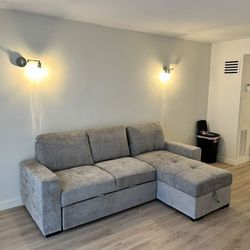 Like New Gray L-Shaped Couch With Storage, Cupholders, and Turns Into a Bed
