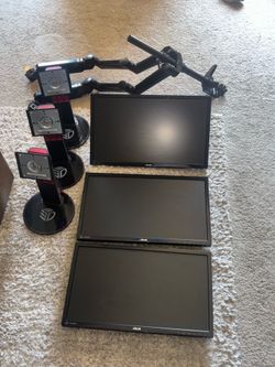 Three monitors with stand