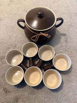 Ceramic pot with lid and serving bowls