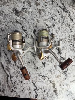 2 Shimano stradic 4000 spinning fishing reel spooled up with braid super smooth