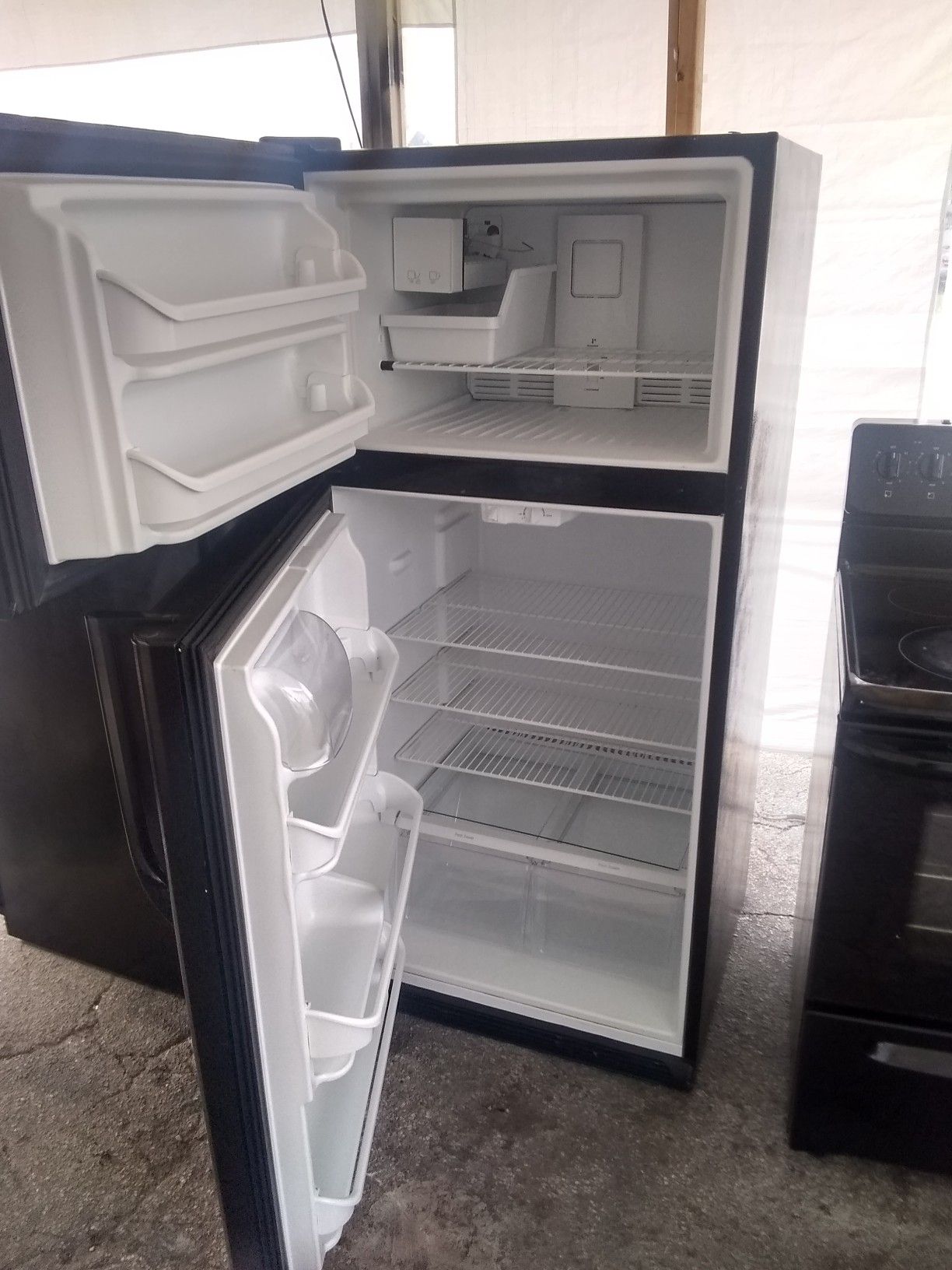 Refrigerator and electric stove all working perfect condition and two mount warranty$340