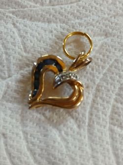 Gold like heart with sapphire on it