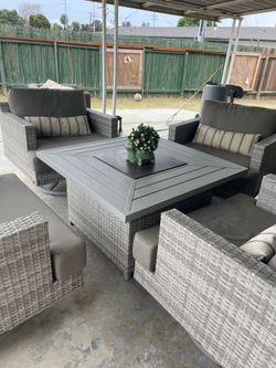 Outside patio set with fireplace