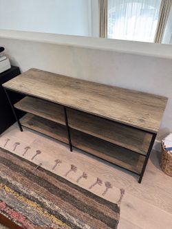 Console table with shelves.