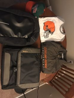 Miscellaneous items: Targus laptop bag, their proof backpack, Browns gear and Bucks snapback cap