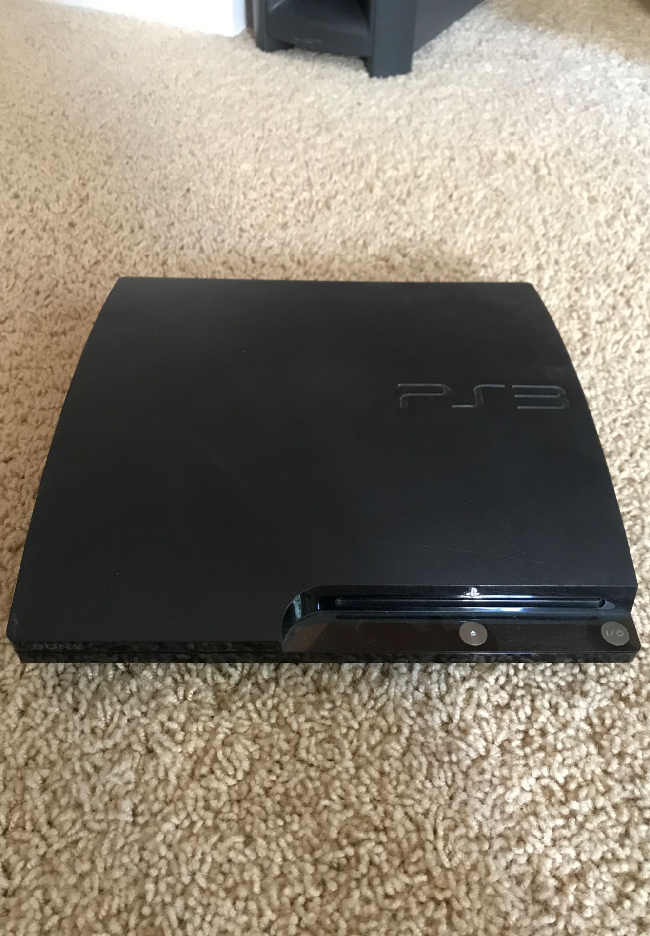 PS3 with one controller and two games