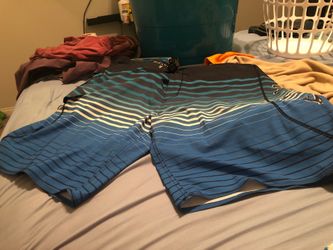 Black and blue striped board shorts size 42 but I was size 40 and I tightened it and still had room to tighten to 40-42 basically used 3 times to swi