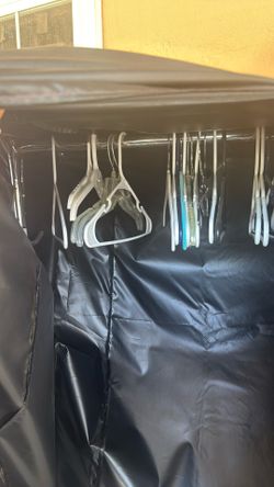 clothes rack with cover and hangers