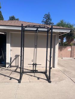 Squat rack with pulley system for weights