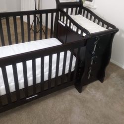 Dark  Wooden Crib/Toddler Bed With Changing Table And Drawers Attached