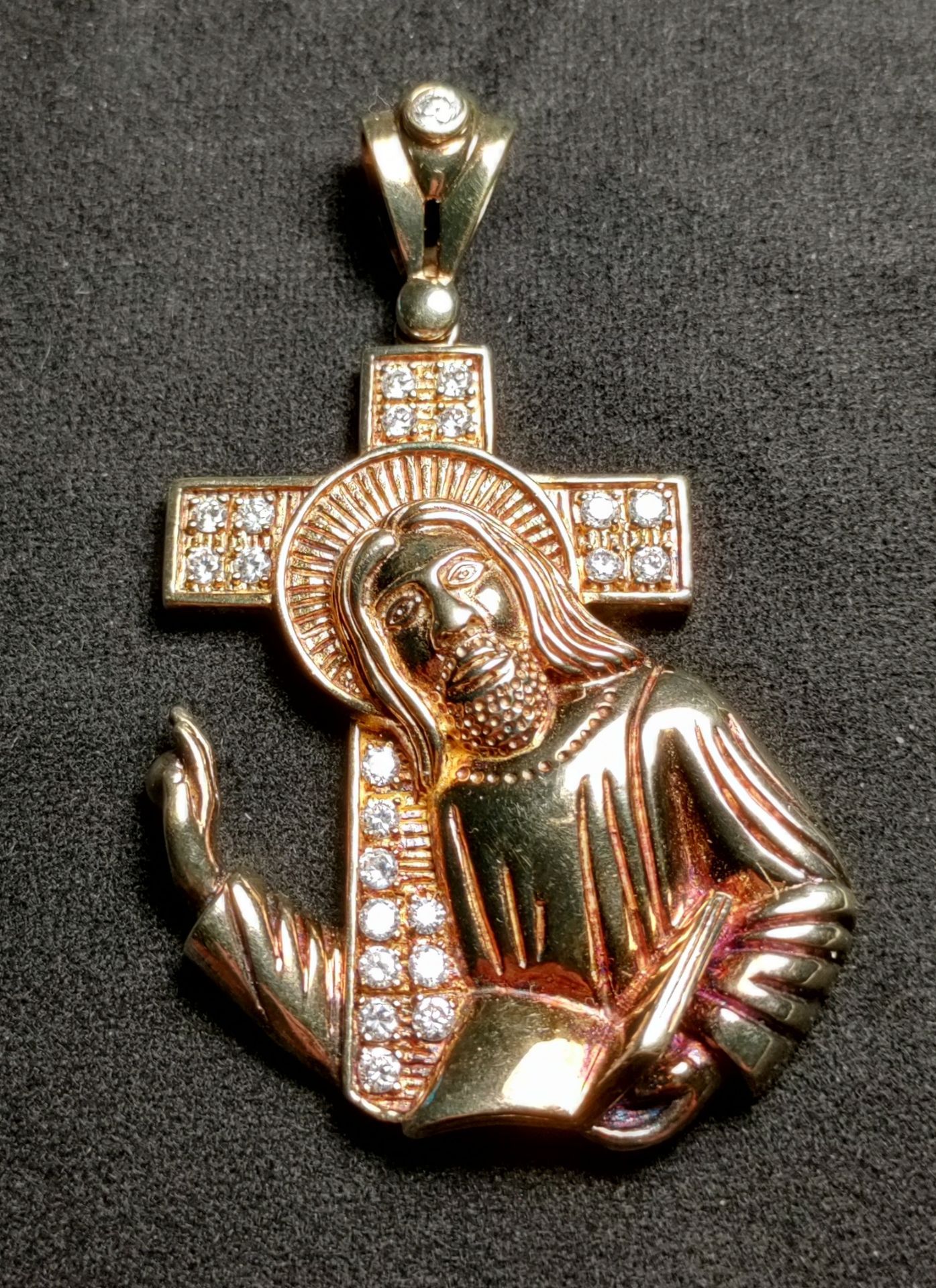 regal ornate pendant of Jesus, precious metals construction