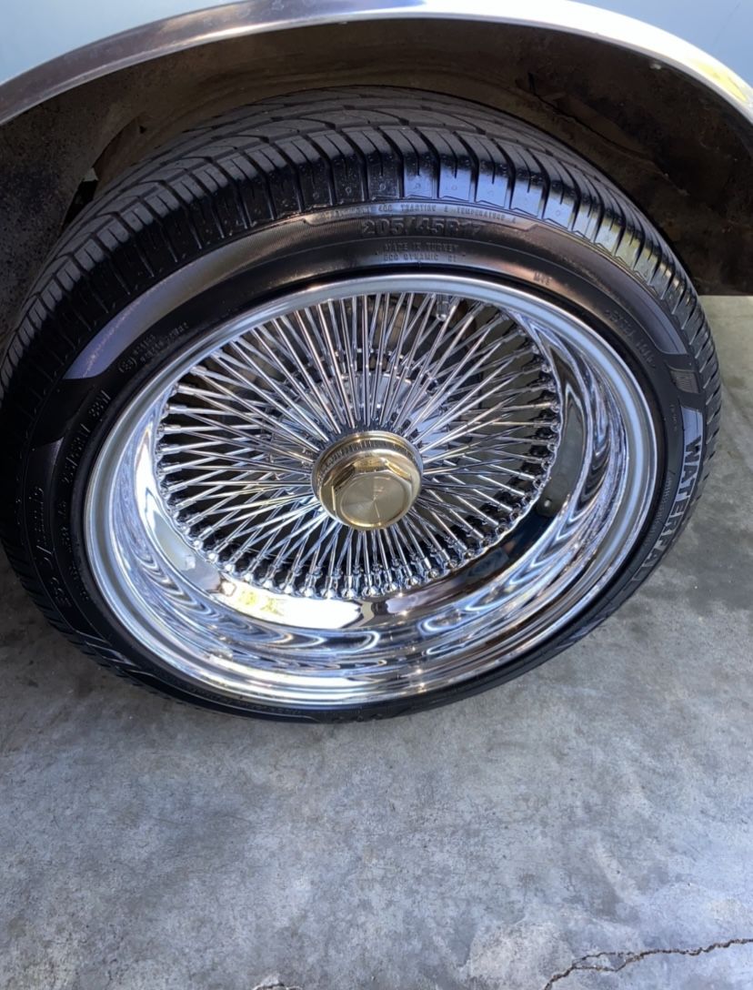 17x7 reverse/deep dish 100 spoke wires with tires.