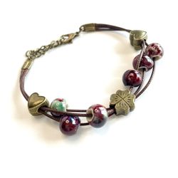 Lucky in love bracelet! Hearts clover and maroon swirled beads adjustable