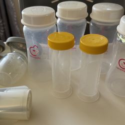 Set of Haakaa Breast Pumps with Silicon Covers & Pack of four 9oz milk storage bottles