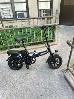 Electric foldable bike with key and charger