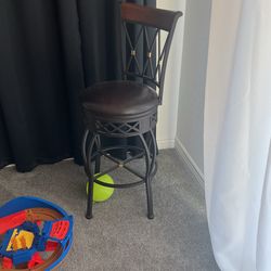 Two Brown Swivel Stools