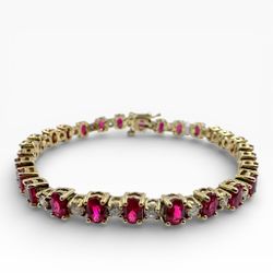 18k Yellow Gold with Rubies 9.80 Carat Tennis 7.00" Bracelet. (New)