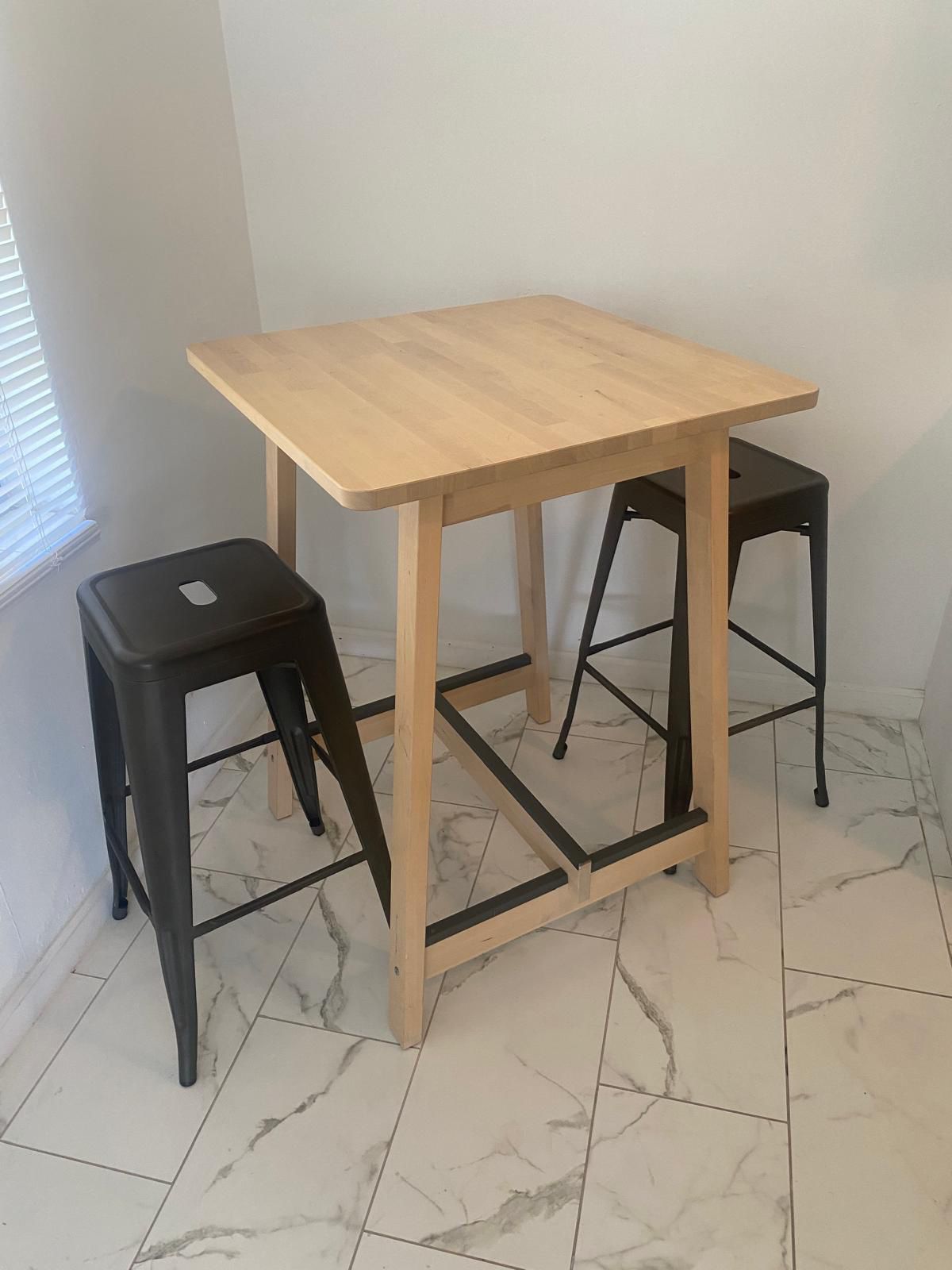 Dining table with two bar stool