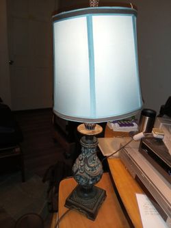 A Vintage Lamp With White Shade