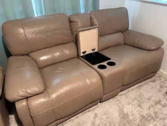 Leather sofa / reclines and glider